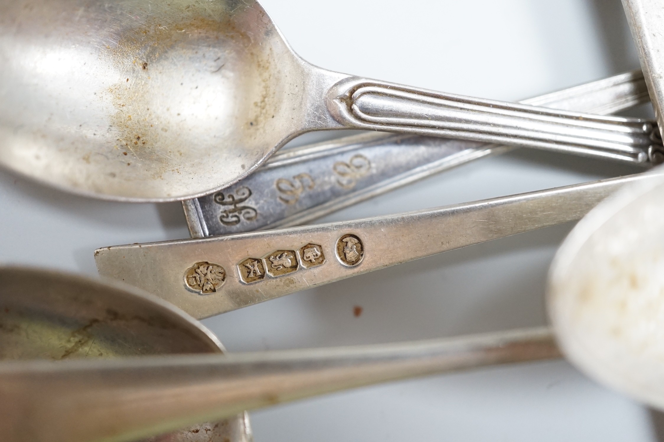 Sundry small silver including a 1930's cream jug, a Victorian mustard pot (no liner), two napkin rings and a small quantity of assorted silver and sterling flatware, 20.8oz.